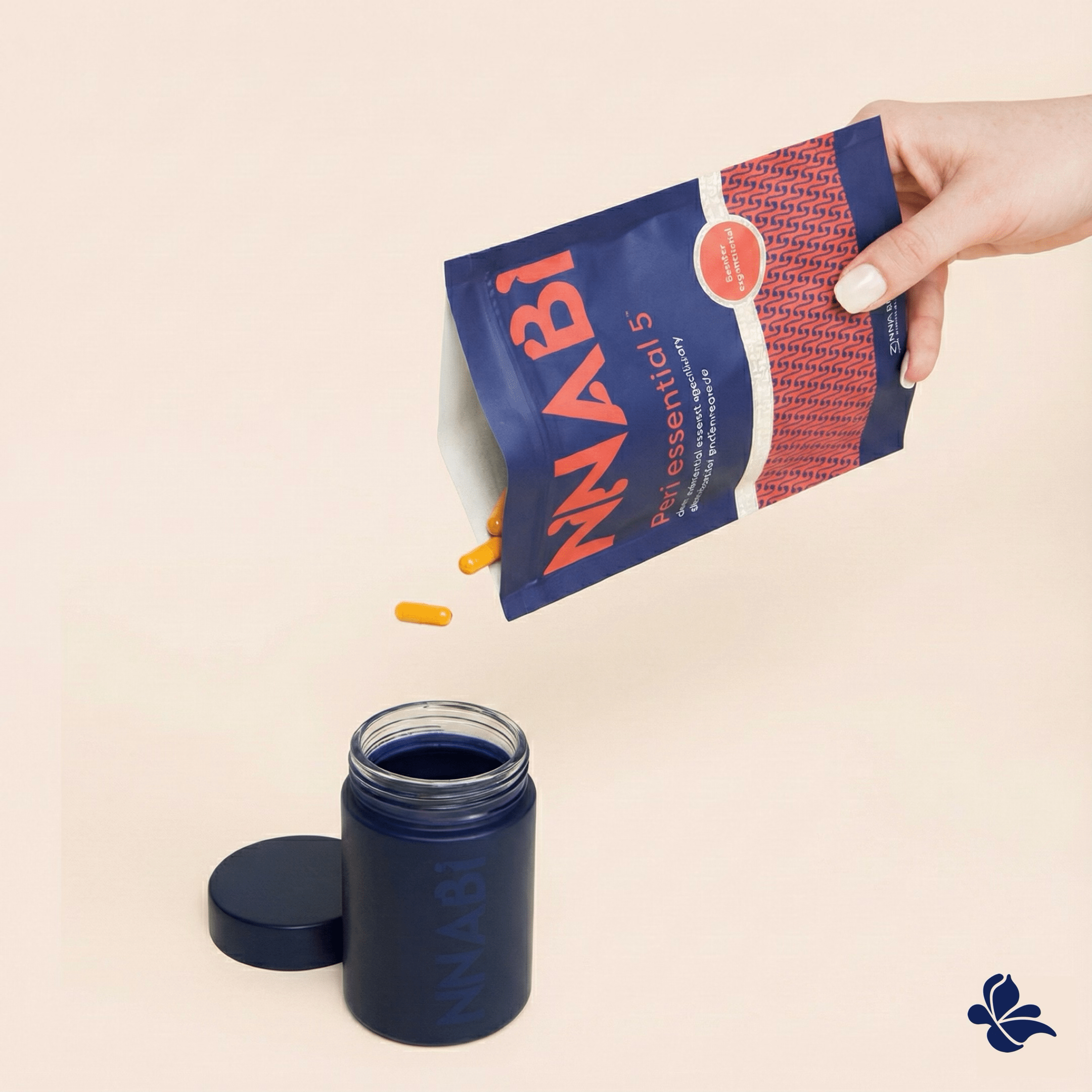 Hand pouring Peri Essential 5™ botanical perimenopause supplement capsules into a glass mother jar